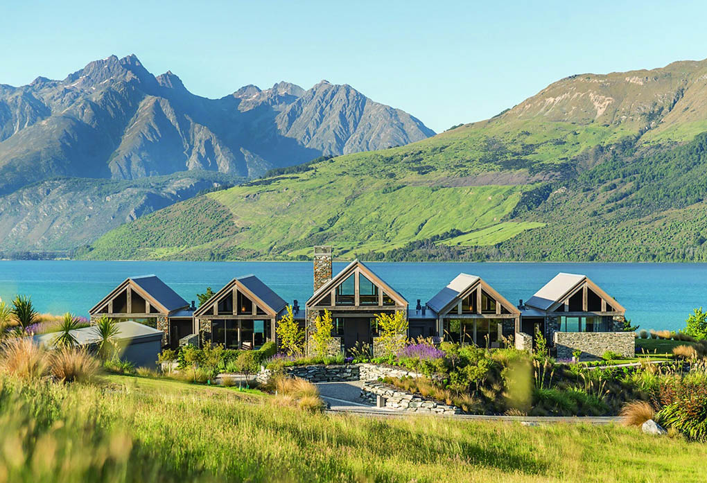 Blanket Bay Villas set within landscaped gardens above Lake Wakatipu with the Humboldt Mountains beyond.