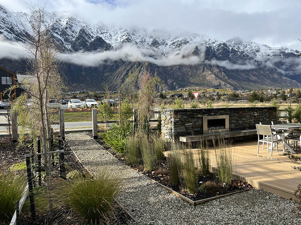 Landscaped garden at Station View with seating, native planting and views to The Remarkables.