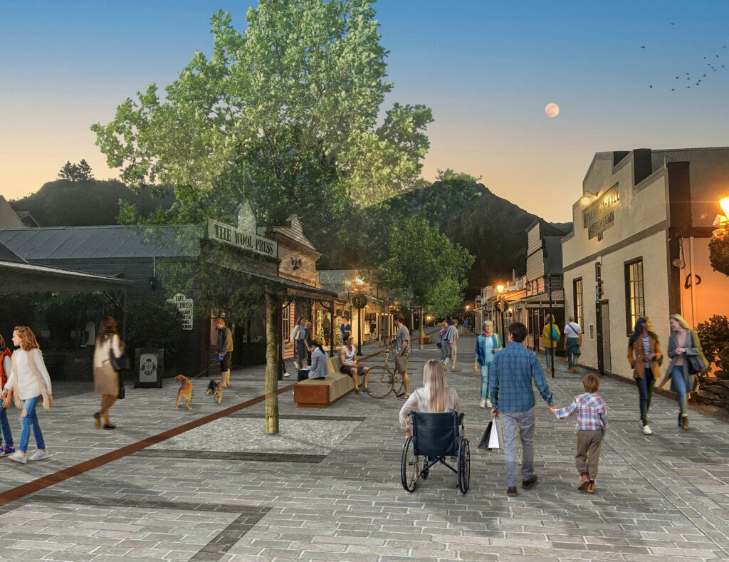 Evening design visualisation of a pedestrian-focused Buckingham Street with stone paving, seating, trees and active shopfronts.